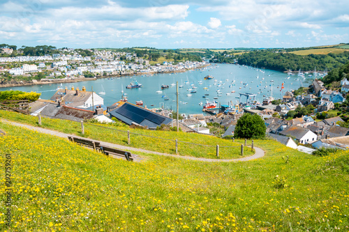 Beautiful Cornish harbour towns of Fowey and Polruan, with boats moored in Fowey Estuary, South Cornwall, UK photo