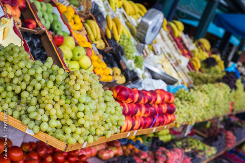Fresh fruit piled high on shelves on a market stall in Rovinj, Croatia.