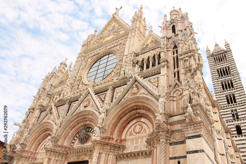 The huge majestic cathedral of Saint Mary of the Assumption on the Duomo Square, a medieval church in Siena, Tuscany, Italy
