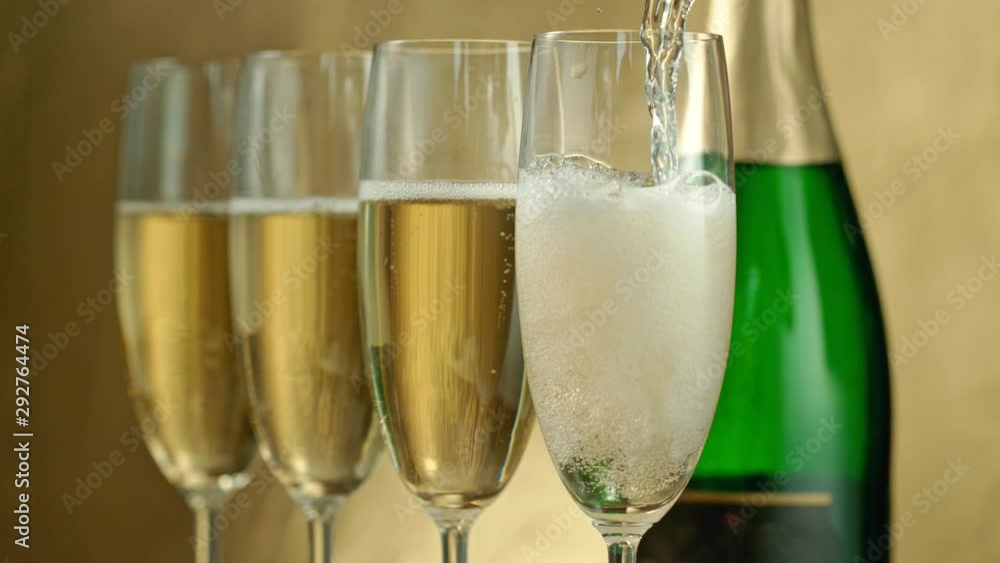 Super Slow Motion Shot of Pouring Champagne on Golden Luxury Background at 1000fps. Super Slow Motion Shot of Pouring Champagne on Golden Luxury Background at 1000fps.