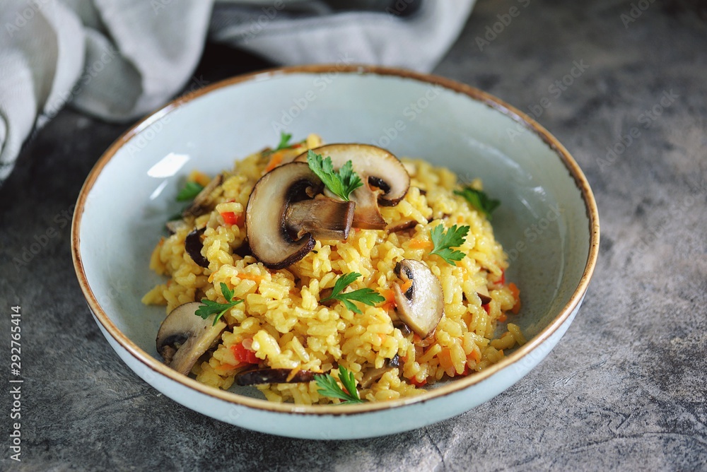 Paella or risotto with mushrooms, bell peppers, carrots, onions, white wine and olive oil. Homemade healthy food. Paella or risotto with mushrooms, bell peppers, carrots, onions, white wine and olive oil. Homemade healthy food.
