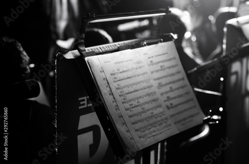 Orchestra music stands. Performance on the stage of a brass symphony orchestra. musician reads musical notes. photo