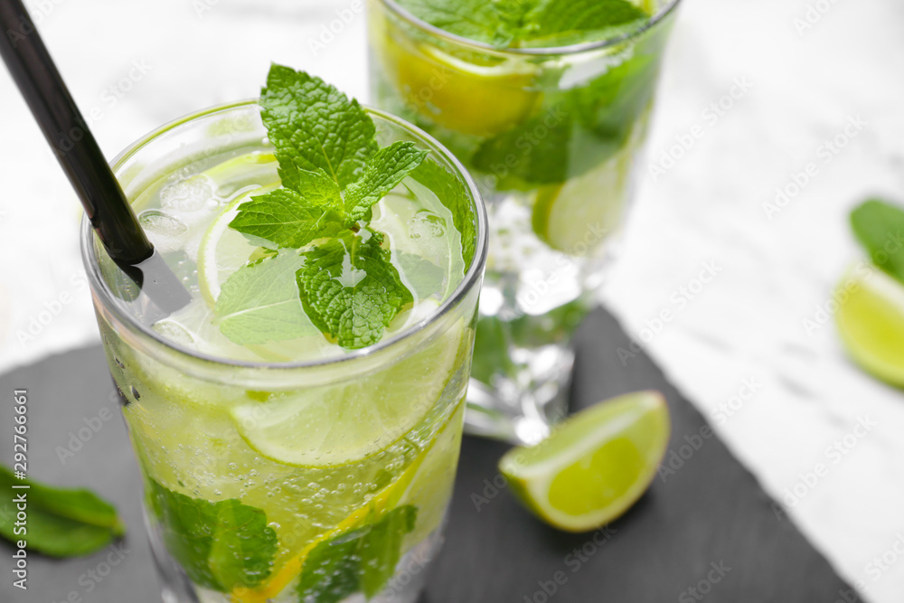 Glass of fresh mojito on table, closeup Glass of fresh mojito on table, closeup