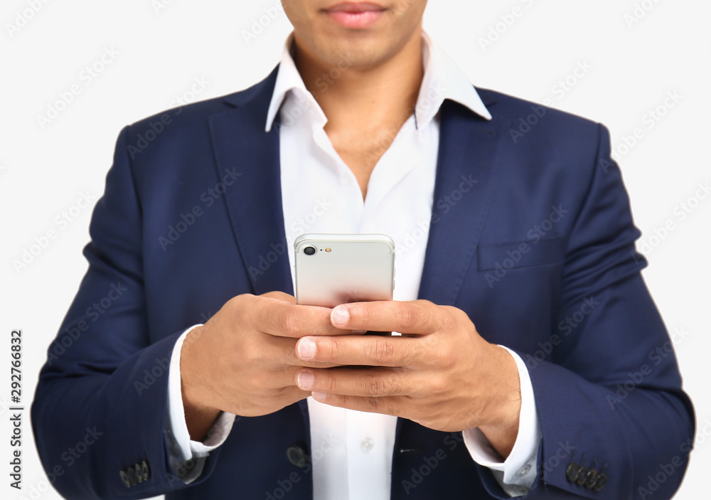 African-American businessman with mobile phone on white background, closeup African-American businessman with mobile phone on white background, closeup