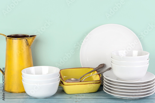 Kitchen dishes and utensils on a shelf © Anna