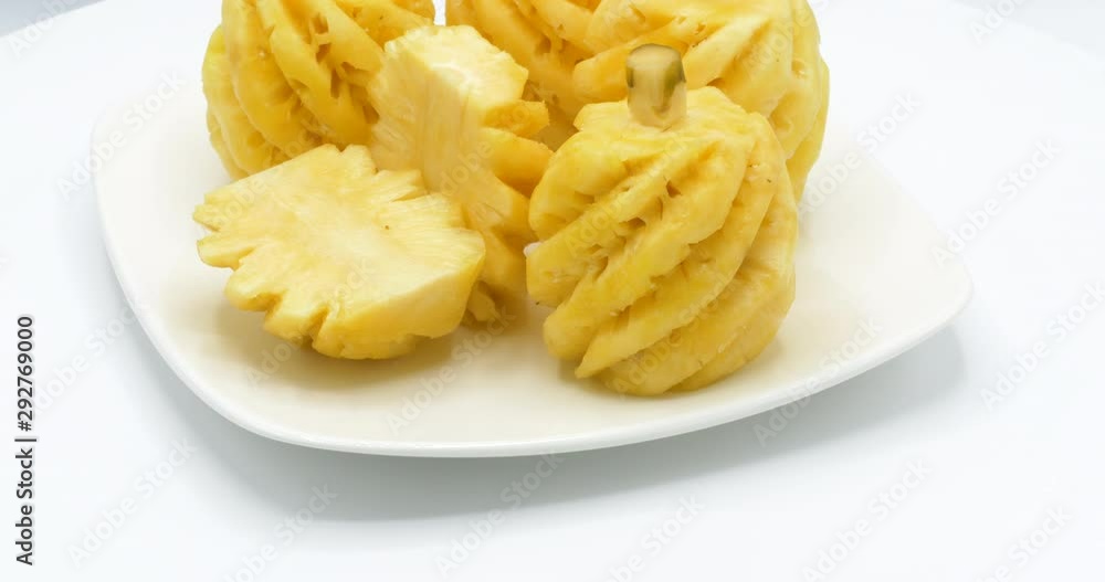 Fresh slice pineapple rotating on white background. Fresh slice pineapple rotating on white background.