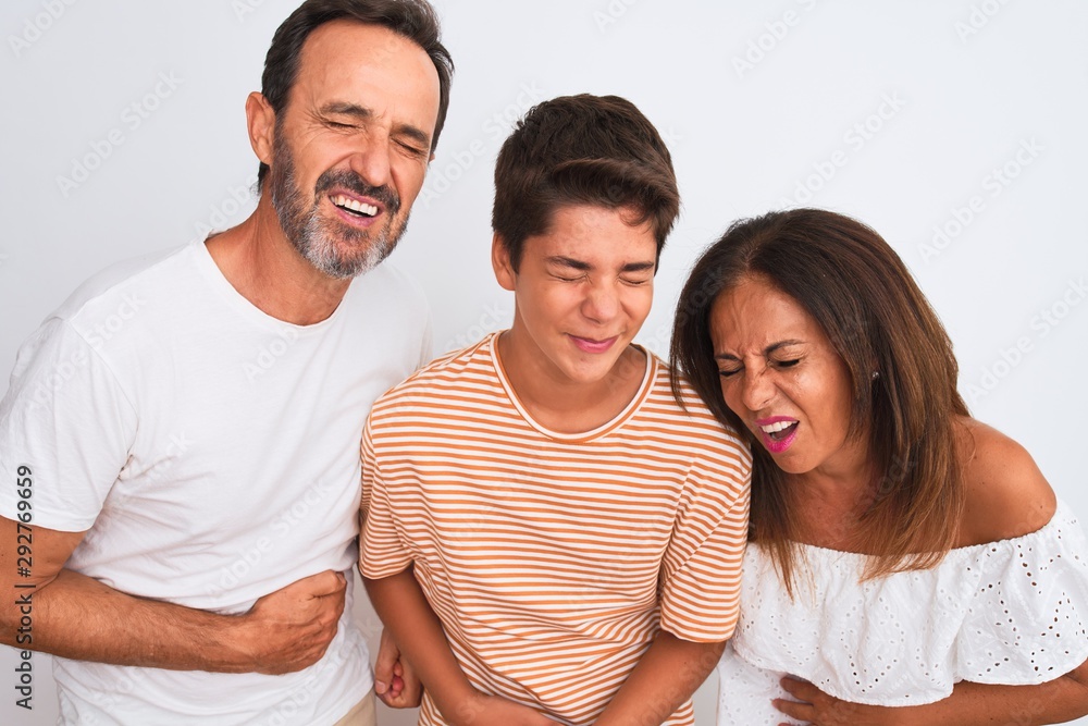 Family of three, mother, father and son standing over white isolated background with hand on stomach because nausea, painful disease feeling unwell. Ache concept. Family of three, mother, father and son standing over white isolated background with hand on stomach because nausea, painful disease feeling unwell. Ache concept.