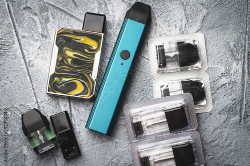 Vape pod system or pod mod with changeable cartridges close up - newest generation of vaping products - small size devices for inhaling higher nicotine strengths