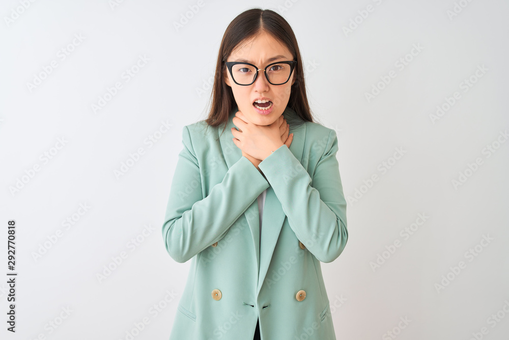 Chinese businesswoman wearing elegant jacket and glasses over isolated white background shouting and suffocate because painful strangle. Health problem. Asphyxiate and suicide concept. Chinese businesswoman wearing elegant jacket and glasses over isolated white background shouting and suffocate because painful strangle. Health problem. Asphyxiate and suicide concept.