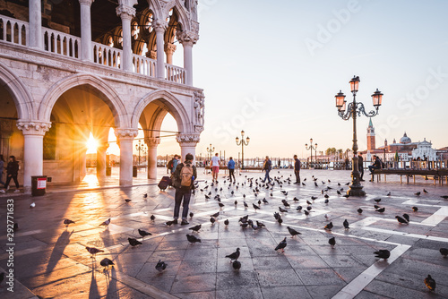 Sunrise view of piazza San Marco, Doge's Palace (Palazzo Ducale) in Venice, Italy. Architecture and landmark of Venice. Sunrise cityscape of Venice.