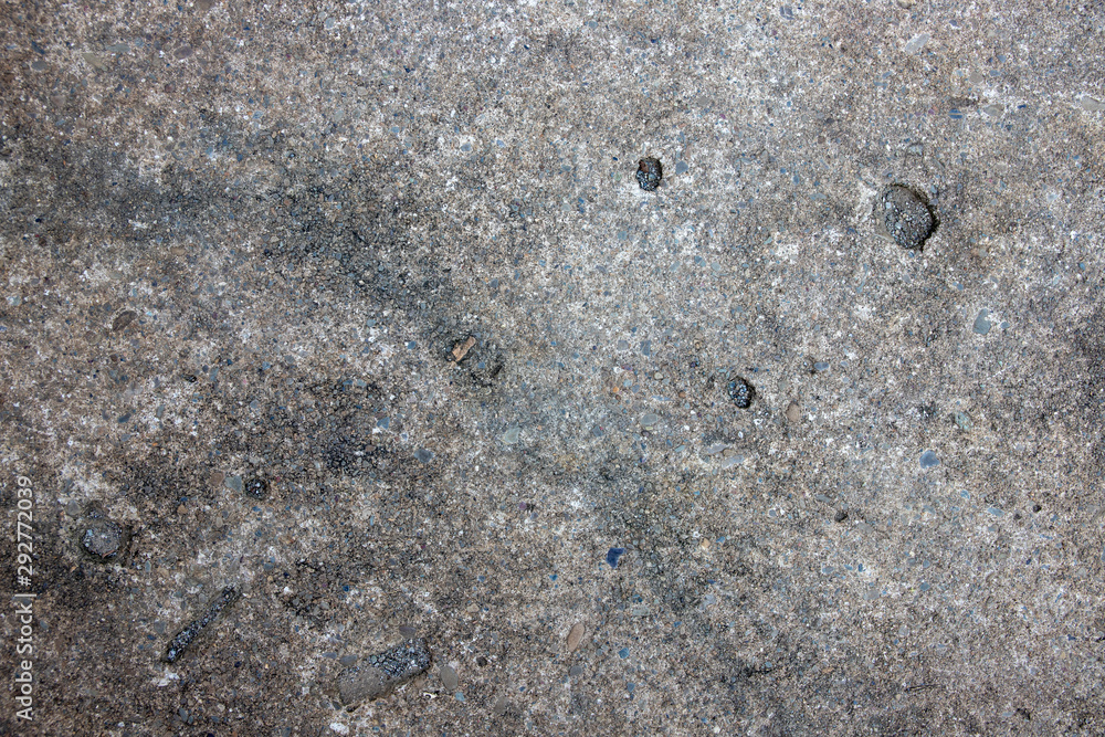 Grungy photo texture of asphalt. Grey concrete top view background. Weathered rock relief. Grungy photo texture of asphalt. Grey concrete top view background. Weathered rock relief.