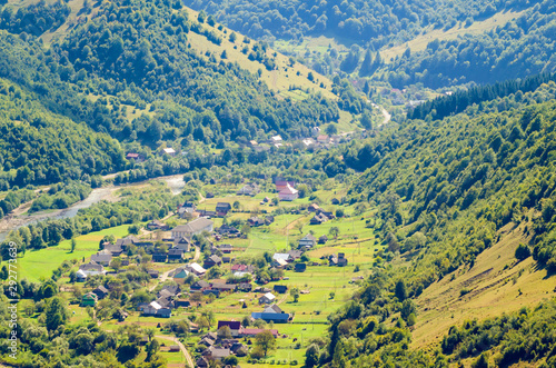 Ukraine Carpathians, a settlement in a valley of mountains, beautiful landscape aerial view