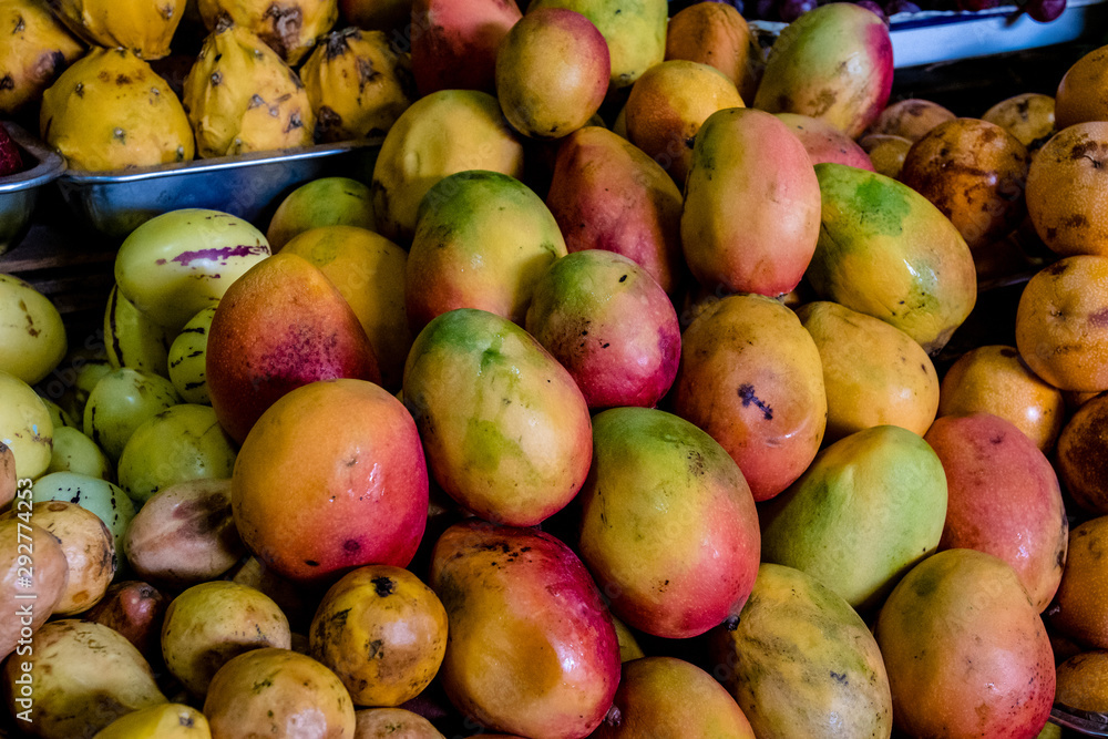 Stack of mangoes for sale in an Ecuadorian market Stack of mangoes for sale in an Ecuadorian market
