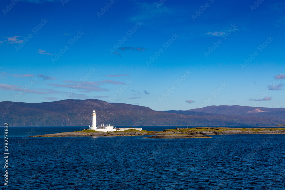 Eilean Muscile Lighthouse on Isle of Mull on a Bright Blue Day, Scotland