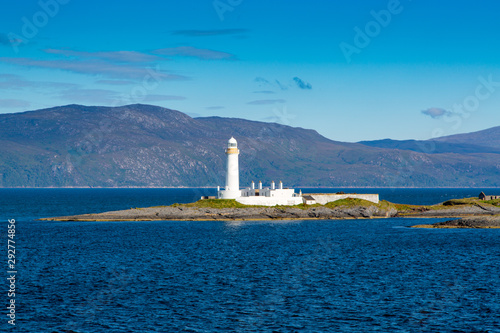 Passing by Eilean Musdile Lighthouse on a Beautiful Day Near Isle of Mull, Scotland
