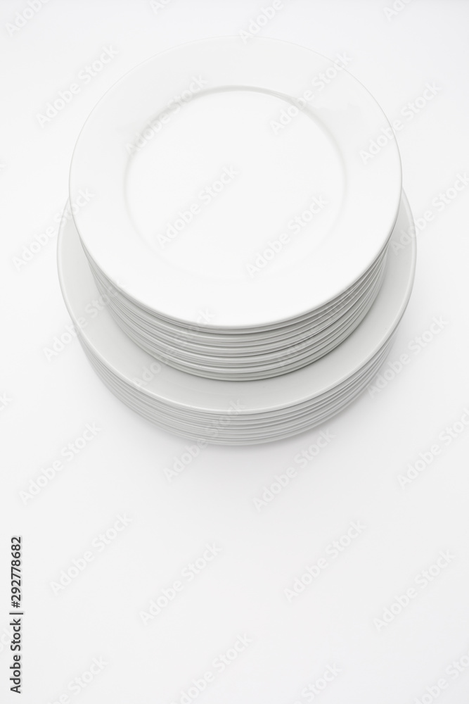 Stack of white plates isolated on white