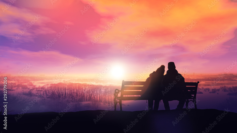 Couple on a bench looks at a winter sunset.