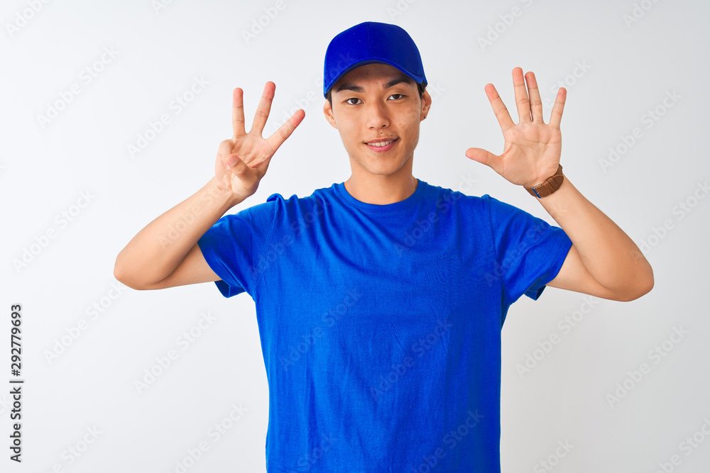 Chinese deliveryman wearing blue t-shirt and cap standing over isolated white background showing and pointing up with fingers number eight while smiling confident and happy.