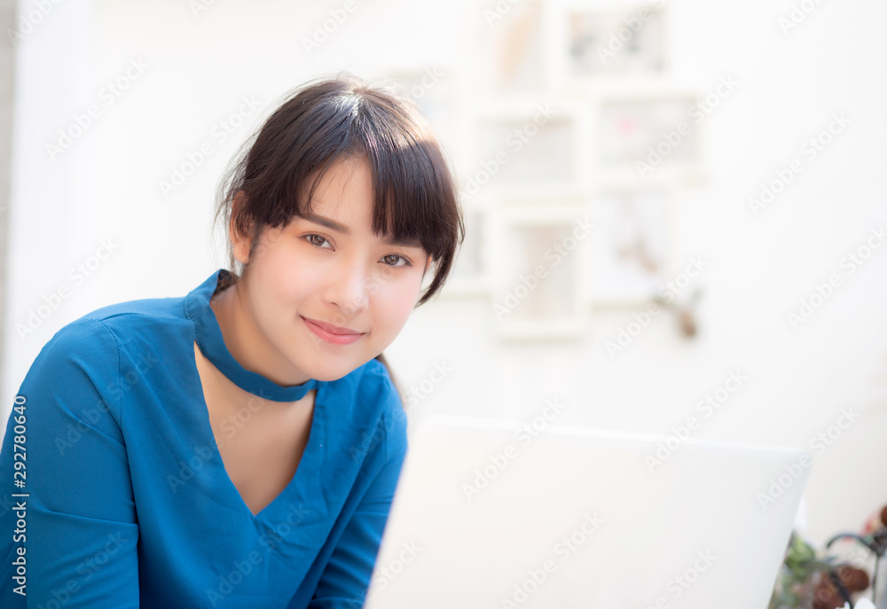 Beautiful portrait asia young woman working online on laptop sitting at cafe shop, professional female freelance using notebook computer, business and communication concept. Beautiful portrait asia young woman working online on laptop sitting at cafe shop, professional female freelance using notebook computer, business and communication concept.