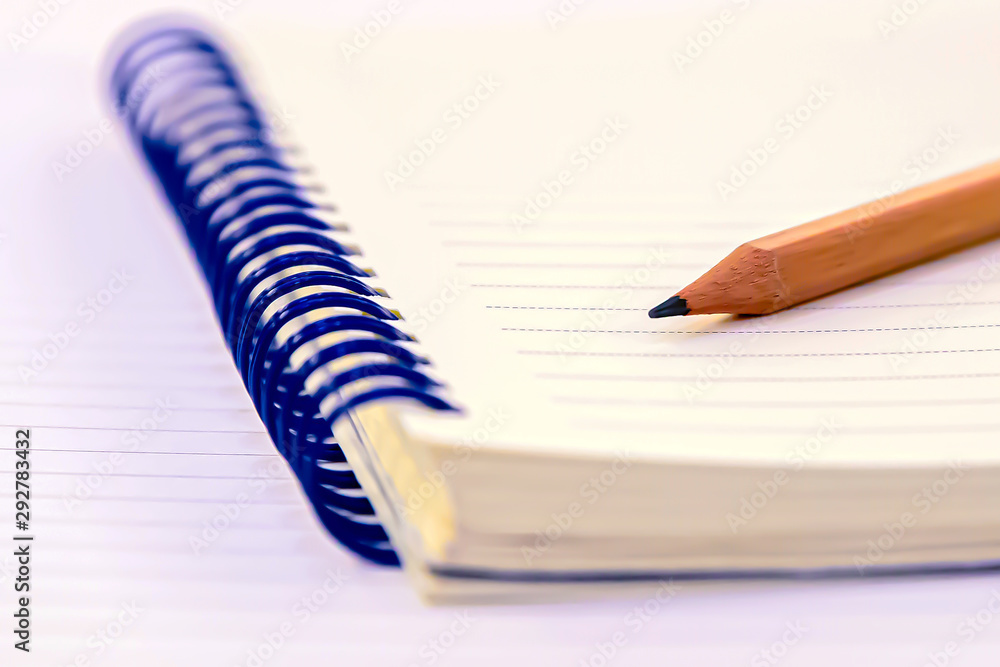 pencil and notebook on the table. pencil and notebook on the table.