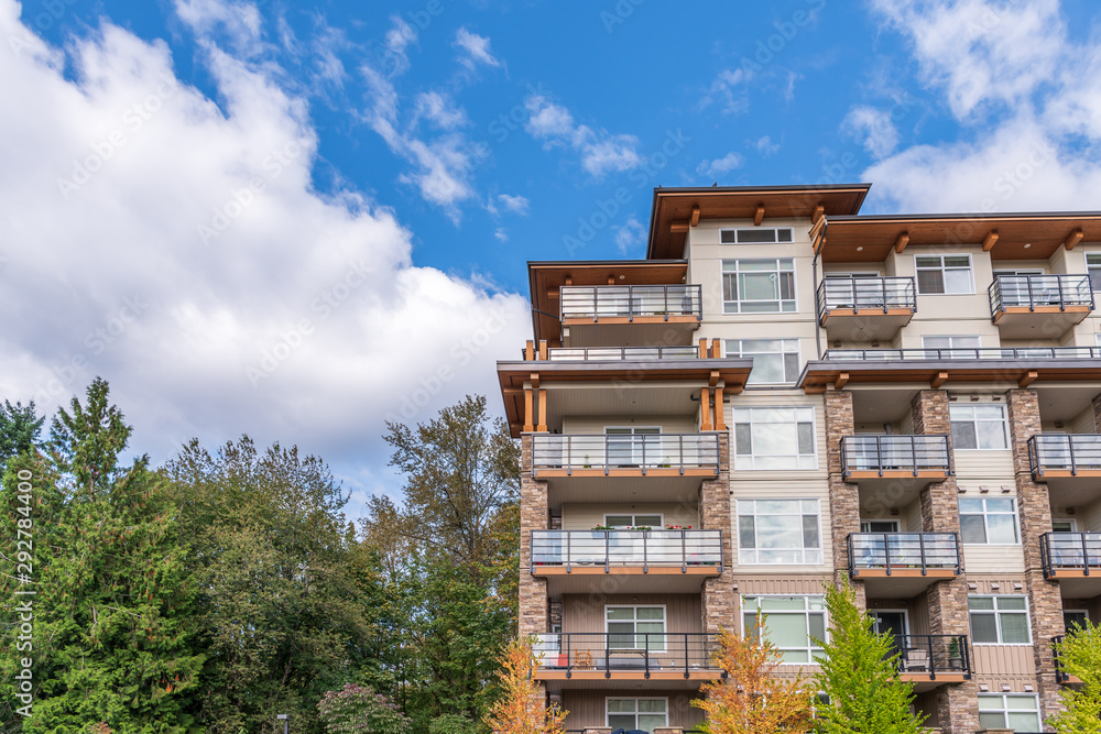 The top of an apartment building with nice windows. The top of an apartment building with nice windows.