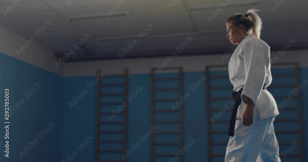 Testing the throw and painful reception on the tatami. Girls are fighting in the gym, training. Testing the throw and painful reception on the tatami. Girls are fighting in the gym, training.