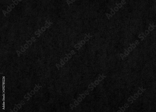 Dark textured black paper background or texture