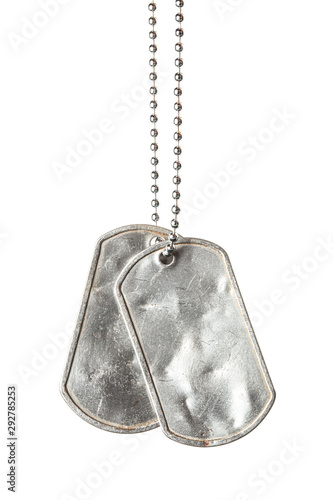 Old and worn blank military dog tags with chain isolated on white