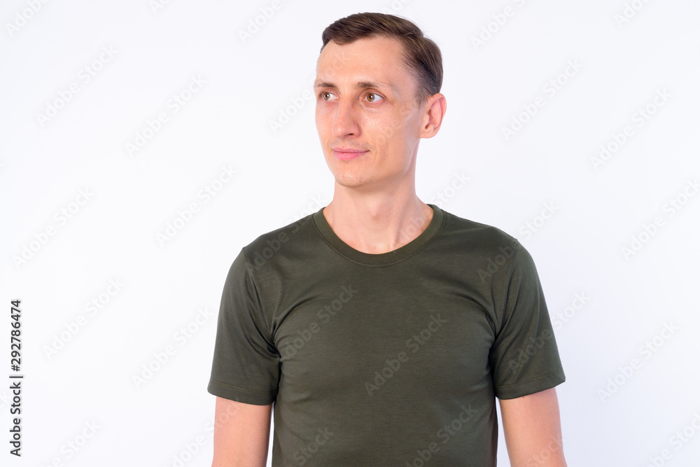 Studio shot of man thinking and looking away Studio shot of man thinking and looking away