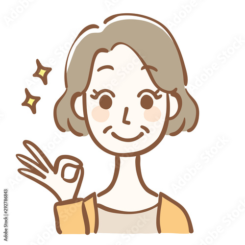 OKサインをする中年女性
