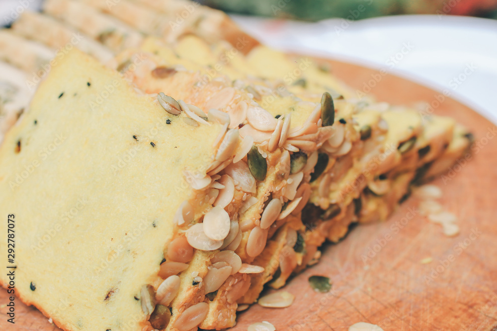 Homemade High fiber natural health food Sliced rye bread on cutting board. Whole grain rye bread with seeds Homemade High fiber natural health food Sliced rye bread on cutting board. Whole grain rye bread with seeds