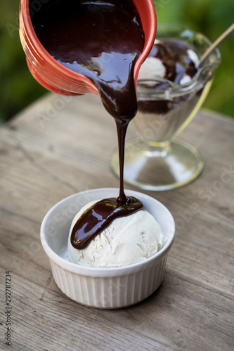 Vanilla ice cream with chocolate sauce photo