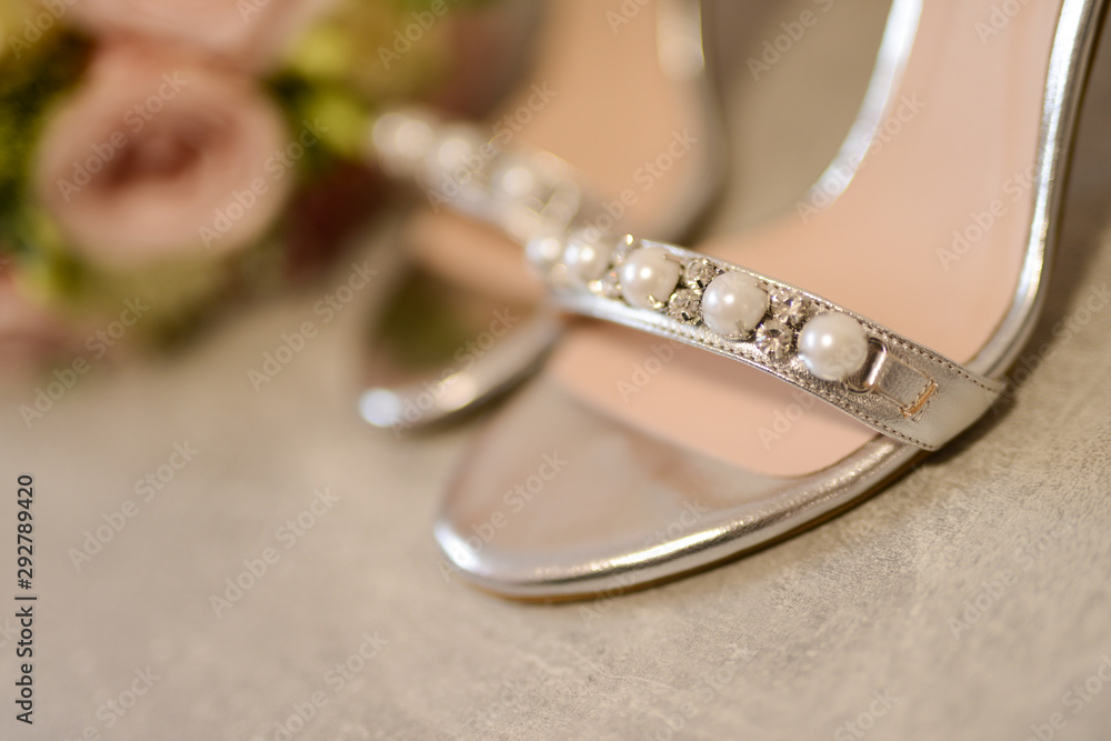 Heels for the bride and beautiful bouquet of flowers Heels for the bride and beautiful bouquet of flowers