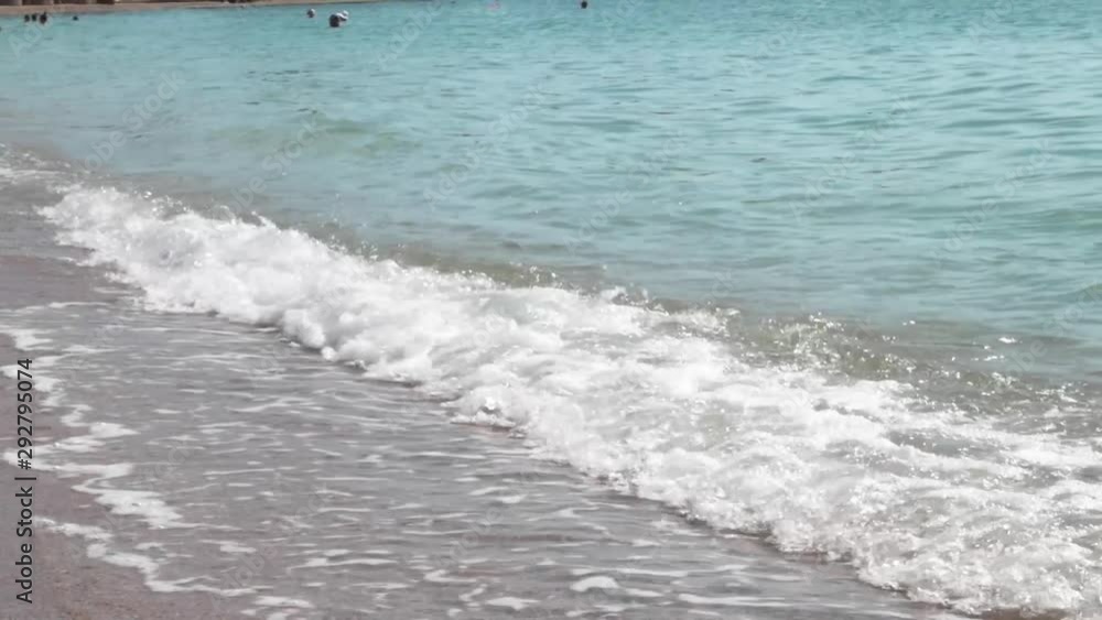 Waves hitting the sand on the greek beach in slow motion Waves hitting the sand on the greek beach in slow motion