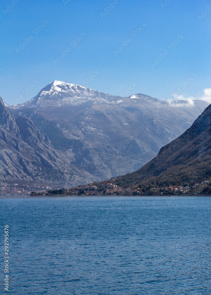 View of a village and cliffs surrounding the Bay of Kotor in Montenegro