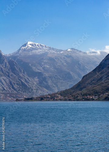 View of a village and cliffs surrounding the Bay of Kotor in Montenegro © Bob
