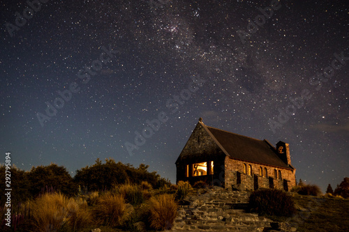 View of milky way and ancient landmark at night, Tekapo © Eugene