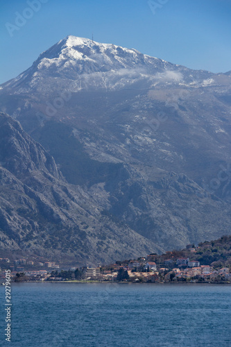 View of a village and cliffs surrounding the Bay of Kotor in Montenegro
