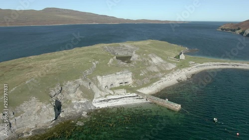 An aerial view of Ard Neakie abandoned lime kilns on a sunny summer's day. Rotating anti-clockwise around the entrance to the kilns. photo