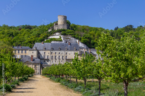 Fototapeta Naklejka Na Ścianę i Meble -  The tower of Chateau de La Roche-Guyon is perched atop the hill above the new chateau and garden
