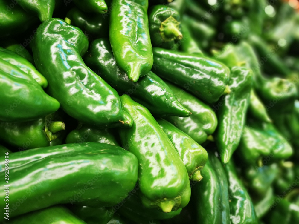 Green pepper in a harvest background. close up shot Green pepper in a harvest background. close up shot