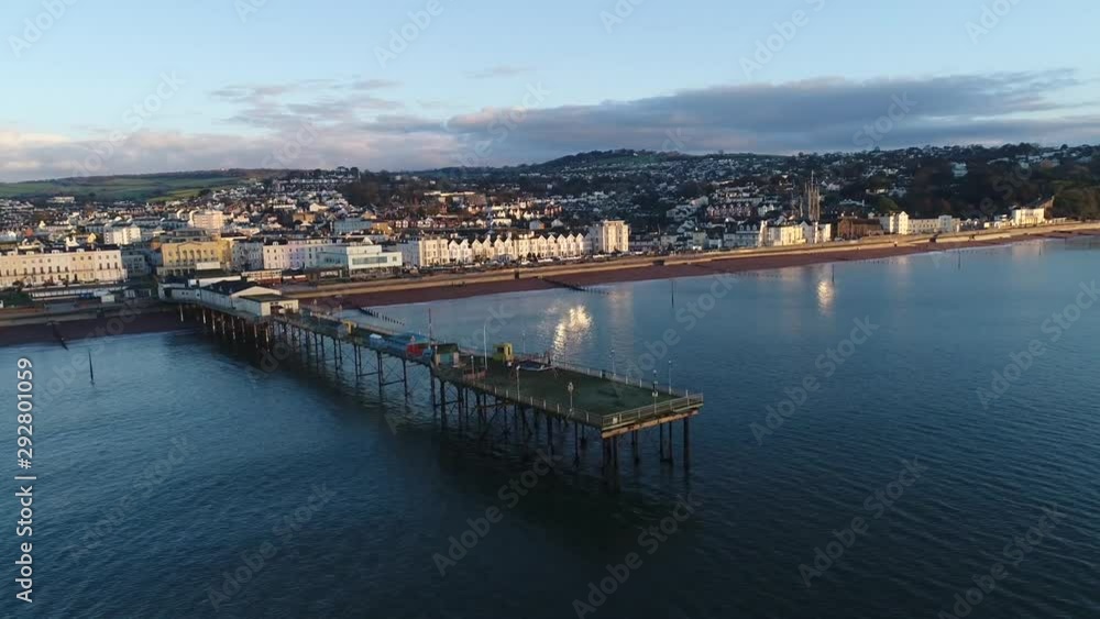 Teignmouth pier sunrise Devon UK slow pan. Aerial view using a drone. Teignmouth pier sunrise Devon UK slow pan. Aerial view using a drone.