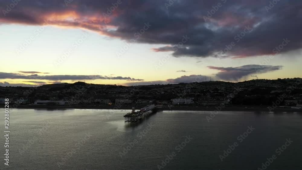 Paignton pier sunset at sea Devon UK. Aerial view using a drone. Paignton pier sunset at sea Devon UK. Aerial view using a drone.