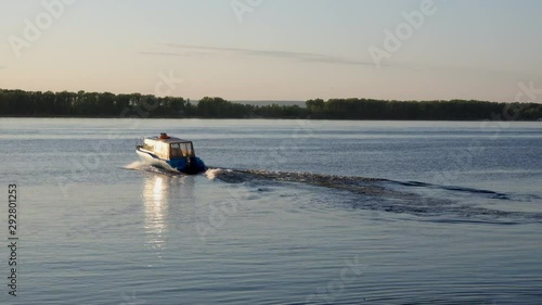 Fishing schooner at sunset, swimming fast.