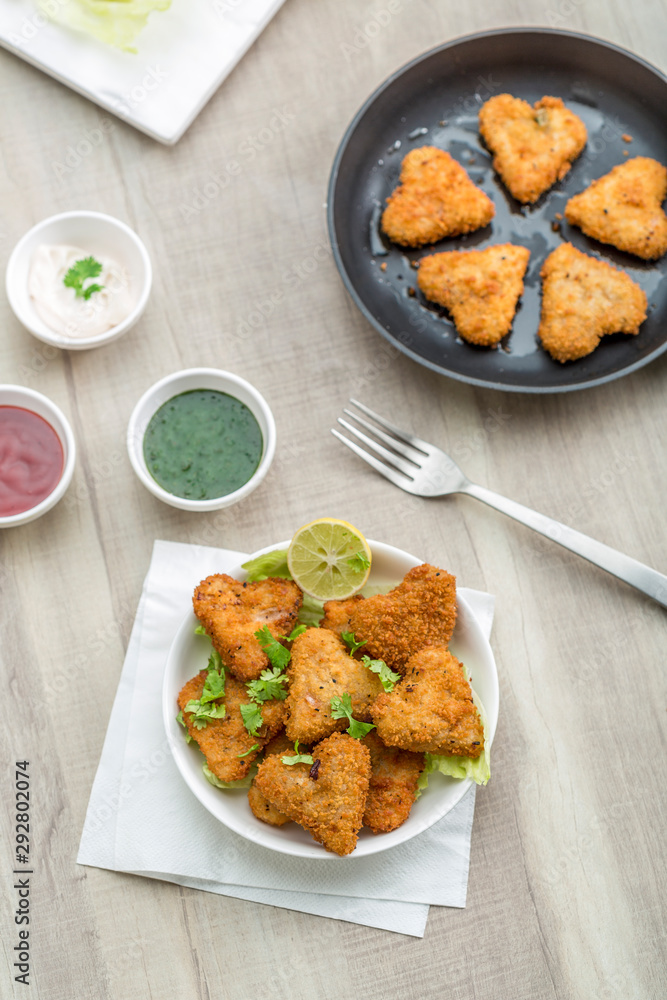 Heart shape cutlets with sauce and green chutney