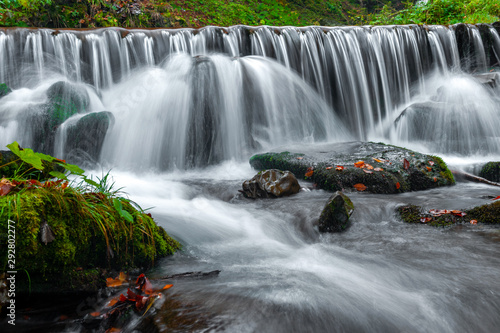 Mountain waterfall in autumn forest