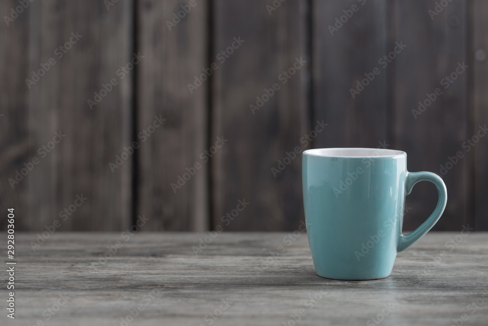 clean cup on old wooden background clean cup on old wooden background