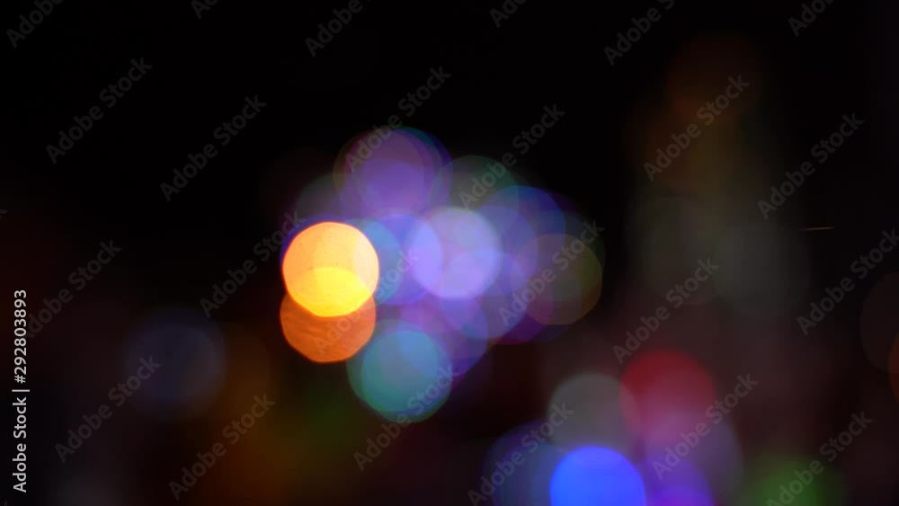 Blurred bokeh traffic on the road at night in a big city, beautiful lights burning different color in the dark. Blurred bokeh traffic on the road at night in a big city, beautiful lights burning different color in the dark.