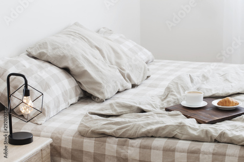 Fototapeta Naklejka Na Ścianę i Meble -  coffee on  tray on the bed in bedroom