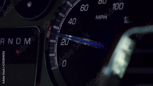 Cinematic focus pull to reveal a speedometer on a roadtrip